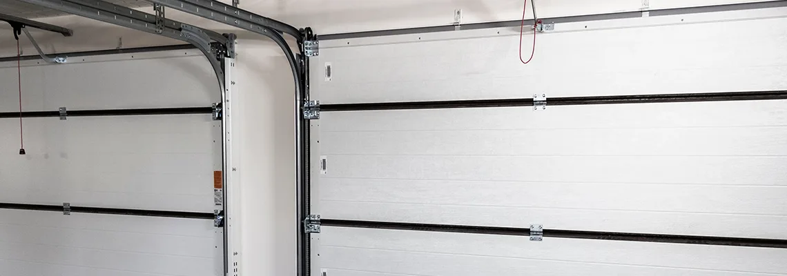 Fix Folding Garage Door Jerking in Schaumburg, Illinois